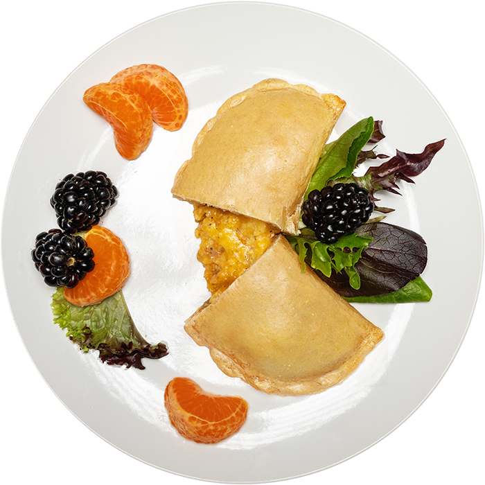 Image of the Turkey Sausage pocket product on a plate, with other assorted foods