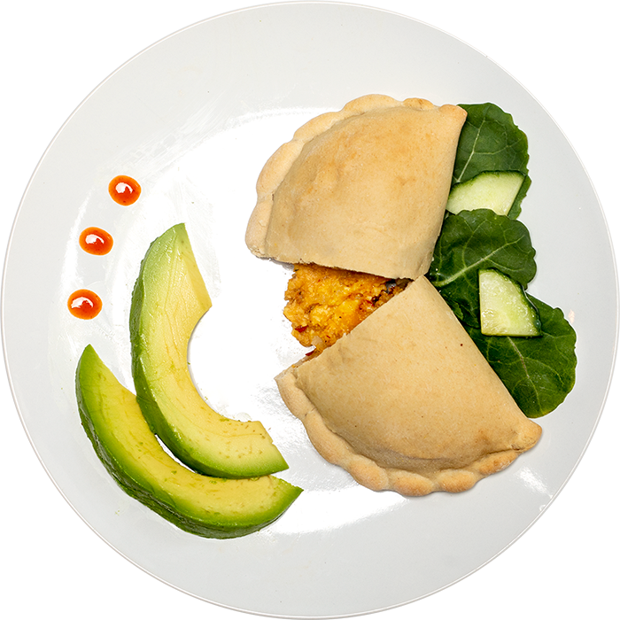 Image of the Turkey Chorizo, Egg & Cheese Pocket product on a plate, with other assorted foods