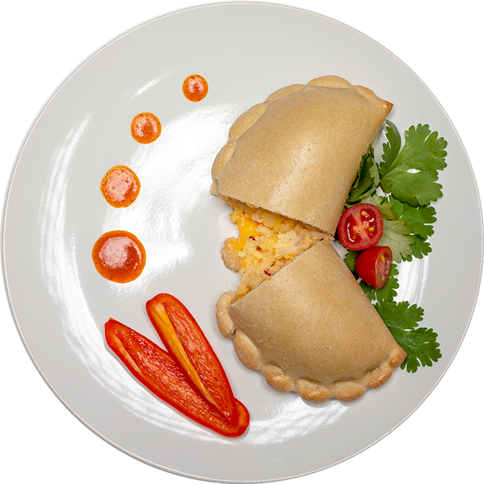 Image of the Spicy Cheddar and Egg Breakfast Pocket product on a plate, with other assorted foods